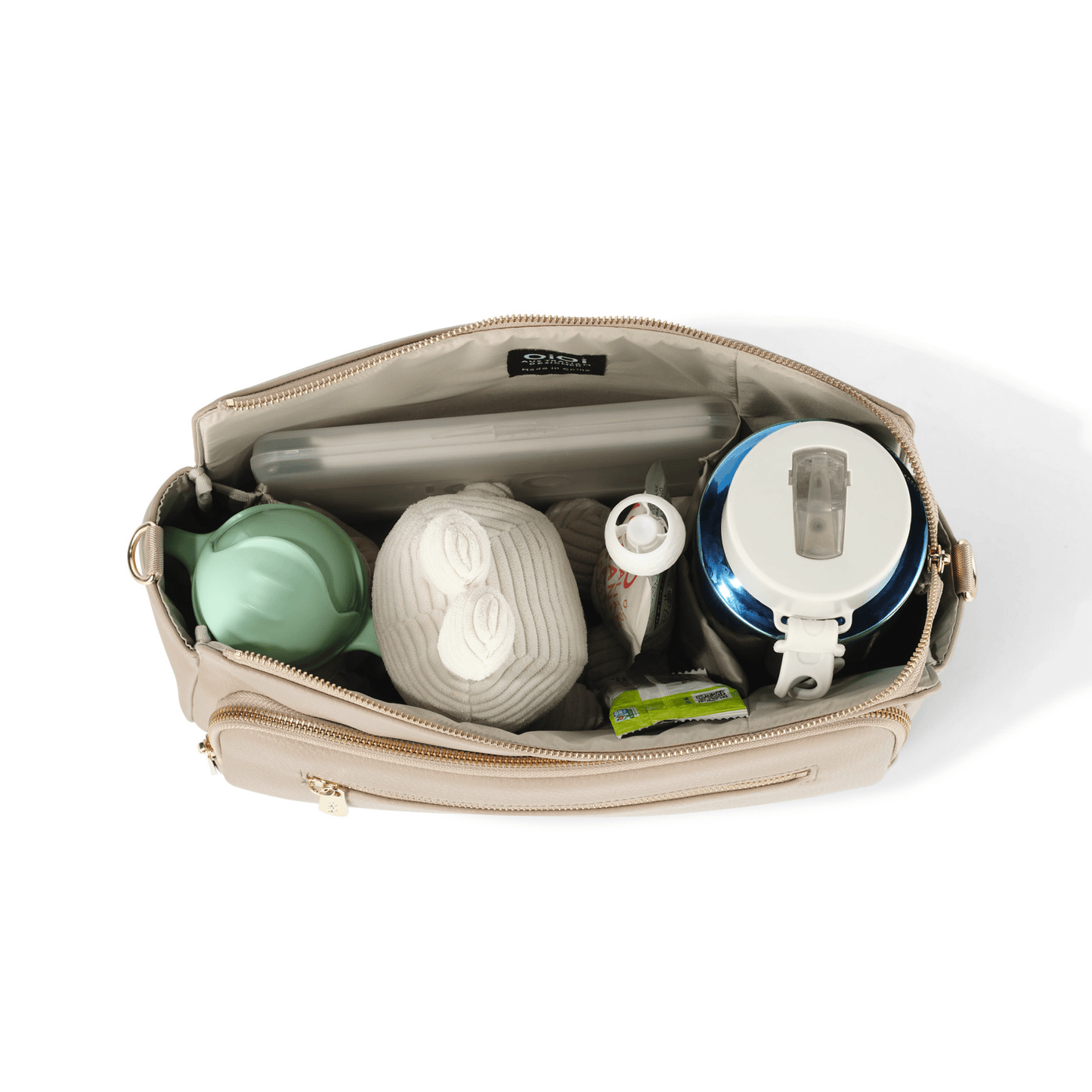 OiOi Pram caddy in oat vegan leather with spacious compartments
