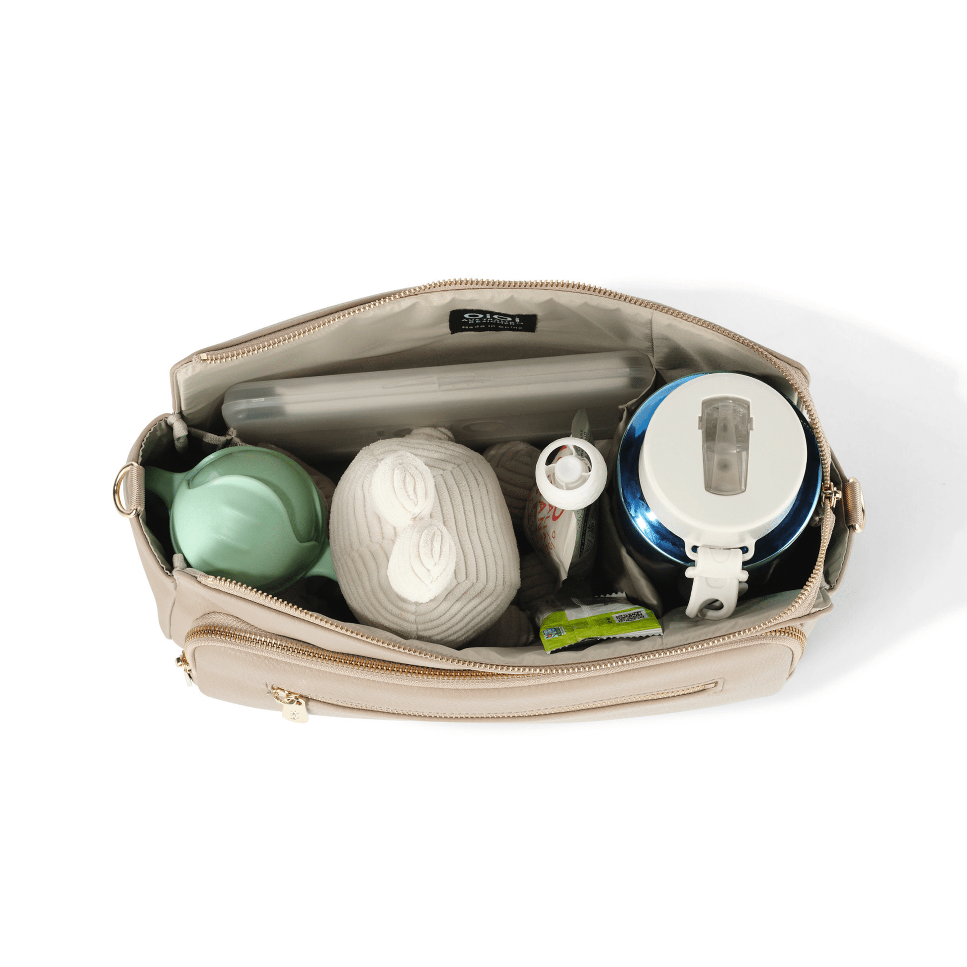 OiOi Pram caddy in oat vegan leather with spacious compartments