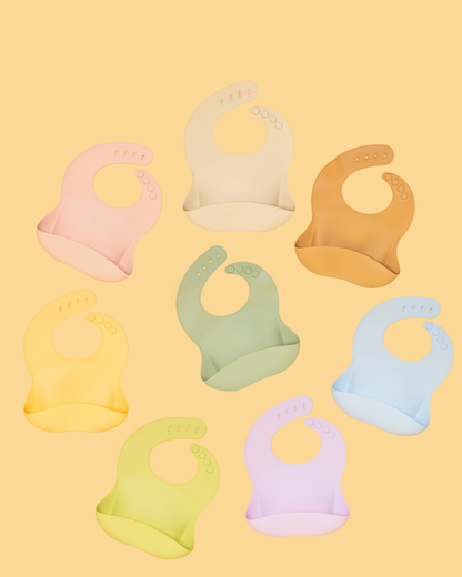 Kiin silicone baby bib with crumb-catching pocket - all 1