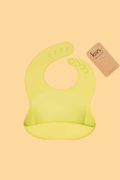 Kiin silicone bib with crumb-catching pocket - green tag 1